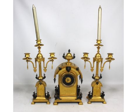 Cahoon Bros of Belfast; a late 19th century gilt brass eight day clock garniture, the domed eight day clock set with gadroone