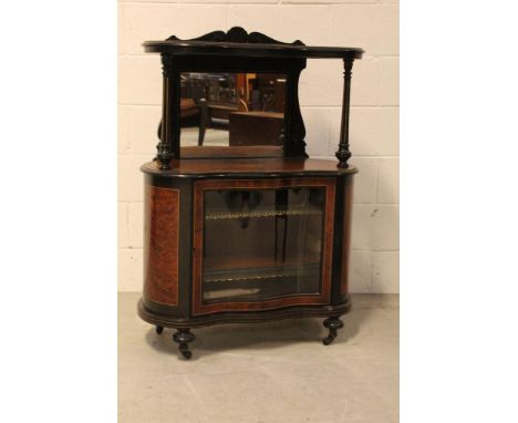 A late Victorian Aesthetics amboyna and ebonised music cabinet with galleried top shelf over a mirrored central section above