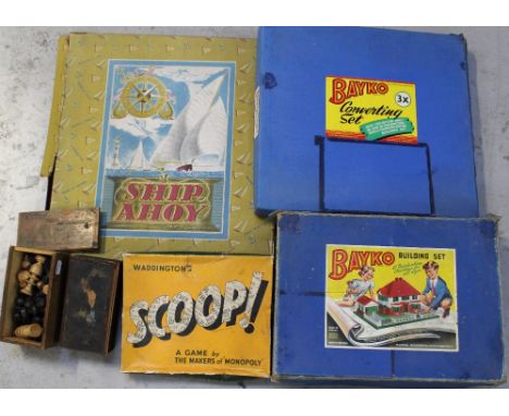 A collection of vintage games to include two boxes of chess pieces, Waddington's 'Scoop' boardgame, a Bayko building set etc.
