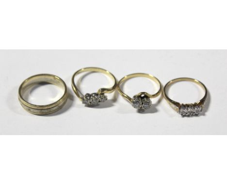 Two 18ct diamond rings, size P, a 9ct chip diamond ring with footprint motif, size N 1/2 and a bi-metallic band ring, size Q,