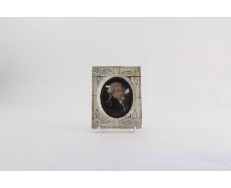UNATTRIBUTED; a late 19th century portrait miniature, a young man in period dress, in piano key frame, 8.5 x 7cm.