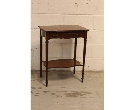 A modern Continental mahogany side table with single frieze drawer supported on fluted turned tapering legs united by a butte