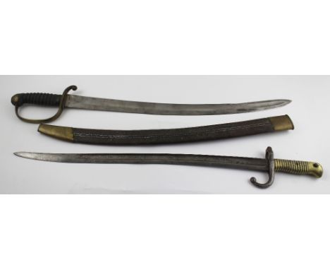 An 1871 patent French bayonet and a 19th century sabre with shagreen grip and leather scabbard, length 70cm.