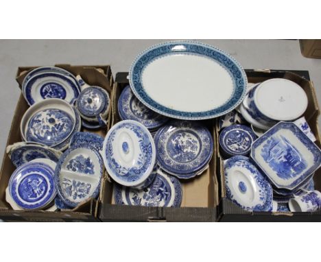 A large quantity of mainly blue and white ceramics to include Johnson Bros willow pattern, Churchill tableware, Ridgeway will
