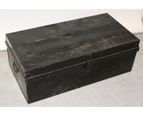 A black metal travel trunk with side handles, length 90cm.