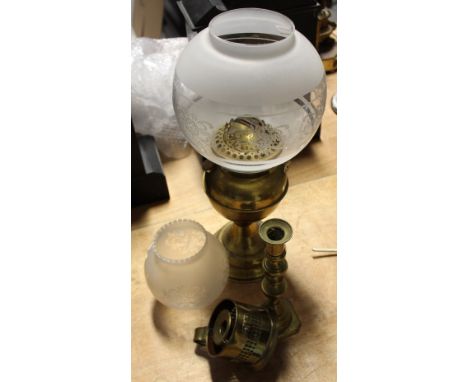 A vintage brass oil lamp with opaque, clear and etched shade, a smaller opaque and clear glass shade for an oil lamp and two 