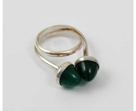 Niels Erik From (Danish 1908-1982); a sterling silver and conical cabochon chrysoprase loop dress ring, marked 'From 925 S' t