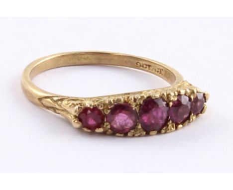 A 9ct gold ladies' dress ring set with five pink stones, size P, approx 2.8g.