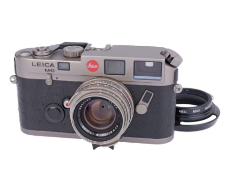 1992, titanium, serial no. 1906648, with Leitz Summilux-M f/1.4 35mm lens, titanium, serial no. 3599780, body, F-VG, shutter 