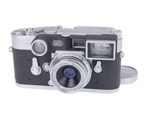 1961, chrome, serial no. 1033682, with Leitz Summaron f/3.5 35mm lens, chrome, serial no. 1563942, body, G, shutter working b