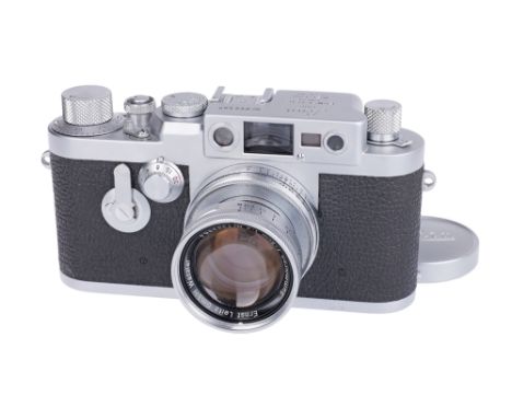 1957, chrome, serial no. 889567, with Leitz Summicron f/2 50mm lens, chrome, serial no. 1393954, body, VG-E, shutter working,