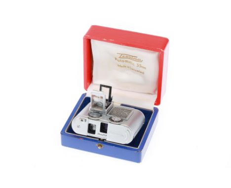 1957-1996, chrome, serial no. 65071, with f/2.8 25mm lens, body, VG, shutter working, lens, VG, some light internal haze, com