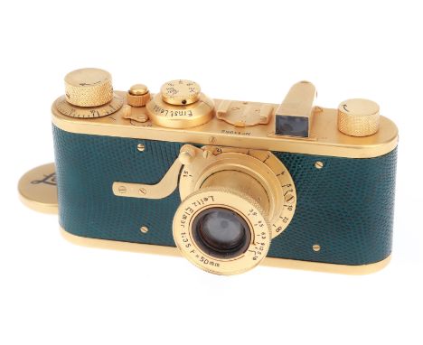 1930, gold, serial no. 11052, with Leitz Elmar f/3.5 50mm lens, gold, body, VG, shutter working, lens, VG, complete with make