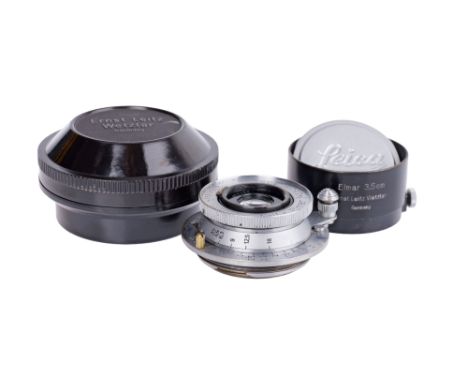chrome, serial no. 570485, body, F, elements, G-VG, some internal haze, complete with Leica FLQOO black paint lens hood and m