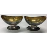 A pair of 19th Century Indian Colonial silver salt cellars with gilt interiors.