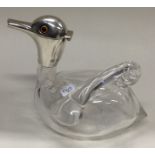 A novelty Victorian silver and glass claret jug in the form of a duck.
