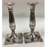 A good pair of 18th Century George III candlesticks on square bases.