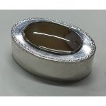 An 18th Century George III silver snuff box with agate stone to lid.