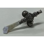 A silver baby's rattle with MOP handle.
