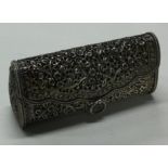 A large pierced silver box in the form of a handbag.