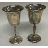 A pair of silver goblets.