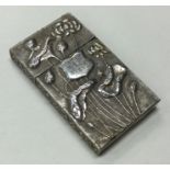 WANG HING: A 19th Century Chinese chased silver card case embossed with flowers to lift-off cover.