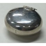 A silver hinged pill box.