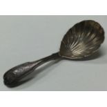 A Georgian silver caddy spoon with fluted bowl.