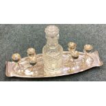 A good silver liqueur set on stand with large cut glass decanter.