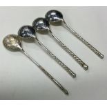 A set of three 19th Century Russian silver and Niello spoons together with one other.