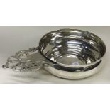 TIFFANY & CO: A silver wine taster.