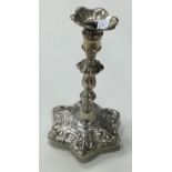 A Victorian silver taper stick.