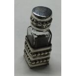 A large silver scent bottle with beaded decoration.