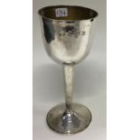 A Modernistic hammered silver goblet.