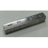 GERALD BENNEY: A silver bar.