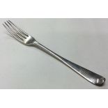 An 18th Century silver four prong fork.