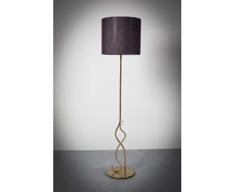 A GILT STANDARD LAMP, FRENCH 1970s, of shaped form, on circular base, 168cm high (incl shade)