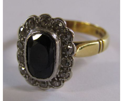 14ct gold sapphire and diamond ring - sapphire approx. 8mm x 5mm surrounded by 14 diamonds - ring size M - total weight 4.4g 