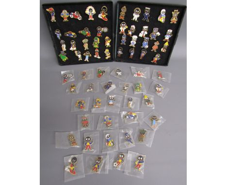 Robertson's Golly pin badges in a Hermes box These items are listed on the basis they are illustrative of a bygone culture in