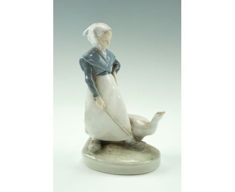 A Royal Copenhagen figurine of a young woman and goose, numbered 528, 18.5 cm