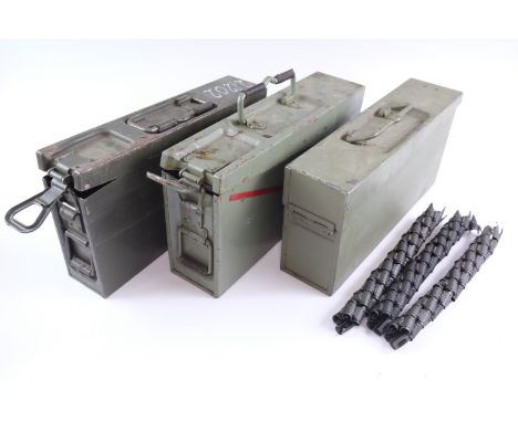 An MG42/53 machine gun belt loader, three ammunition boxes and belts