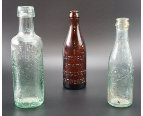 Three vintage glass bottles, comprising 'Carlisle State Management Breweries', 'Caley's' and 'The Carlisle Old Brewery', tall
