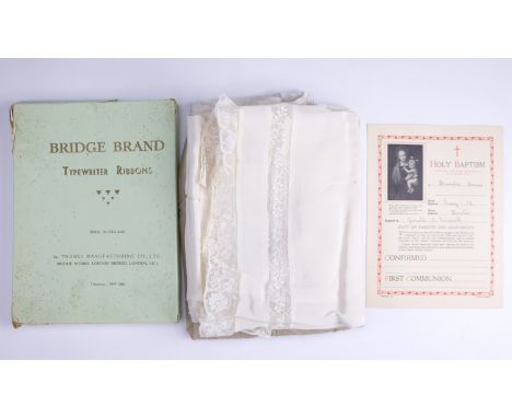 An antique lacework blanket together with a vintage christening gown