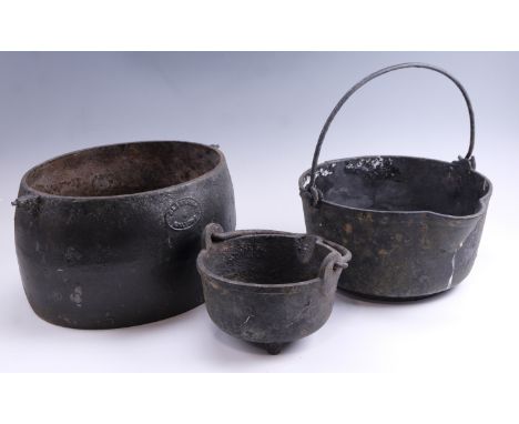 Three cast iron cooking pans, (two a/f), largest 30 x 43 x 21 cm