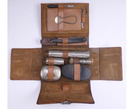 A vintage leather cased gentleman's travelling dressing kit, 21 x 16 x 6.5 cm