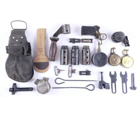 Sundry military gun tools and parts including a Bren LMG carrying handle, oil bottles, a Sten type magazine loading tool, sig