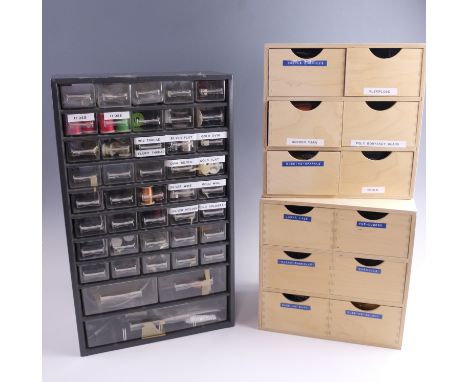 A quantity of fly fishing accessories, including tools, floss, sparkle dubbing, silver and gold wire, etc, in three wood and 