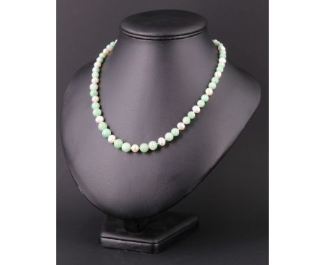 A contemporary jade and pearl necklace together with a white and green jade bracelet, both having 925 white metal clasps, res