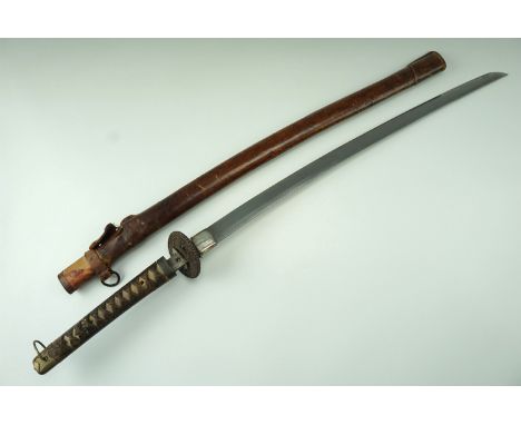 An Imperial Japanese army officer's sword, its tang un-marked and having two mekugi ana, the tsuka incorporating dragon-form 