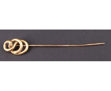 A Victorian yellow metal stick pin having a knot terminal, 7.5 cm, 2.3 g